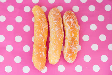 Breads on polka dot pink backgroundの写真素材