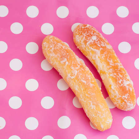 Breads on polka dot pink backgroundの写真素材