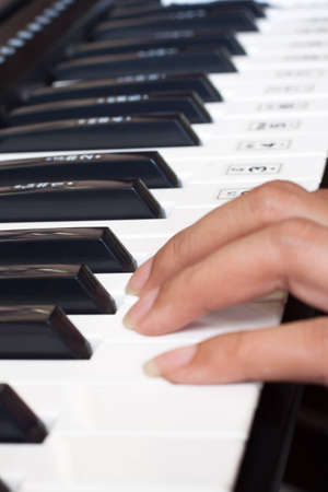 piano keyboard with womanの写真素材