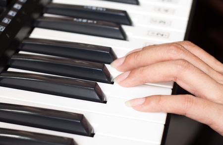 piano keyboard with womanの写真素材