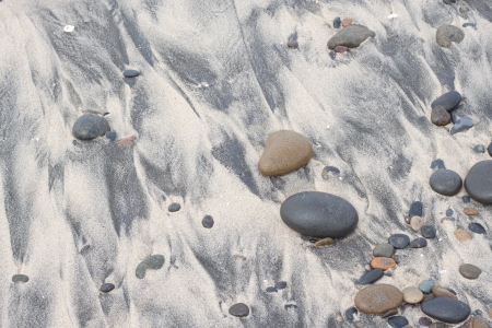 pebble on sandy beach and stonesの写真素材