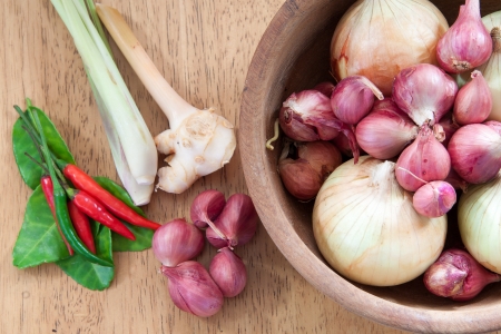 Thai herb ingredients for Tom Yum in wooden bowlの写真素材