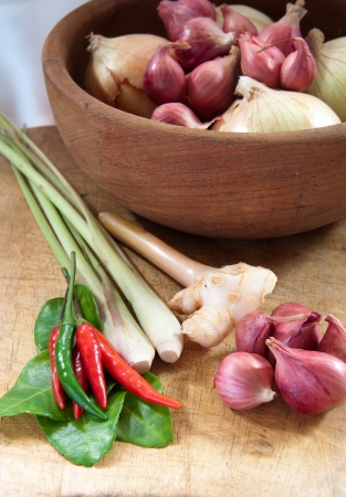 Thai herb ingredients for Tom Yum in wooden bowlの写真素材