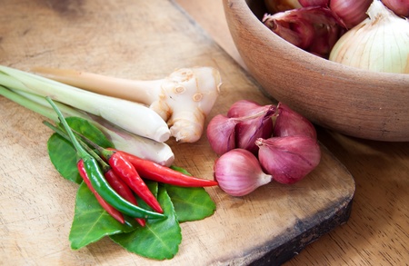 Thai herb ingredients for Tom Yum on woodの写真素材