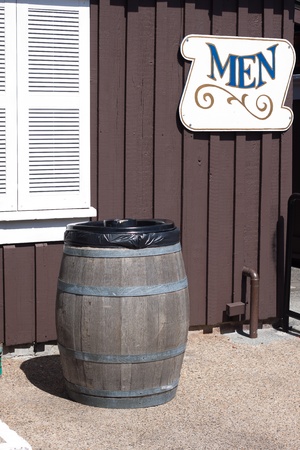 trash can made from wine bucket stand infront of restroomの写真素材