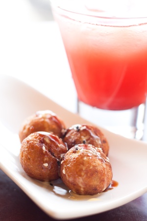 Takoyaki, octopus balls, Japanese foods on white plateの写真素材