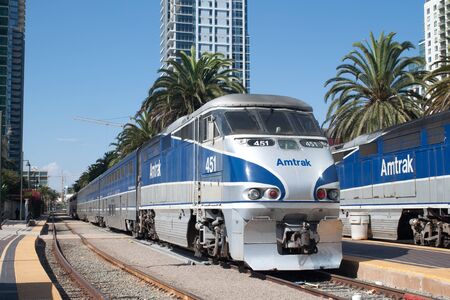 An Amtrak California passenger train leaves the Santa Fe Depot stationのeditorial素材