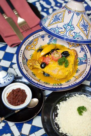 Indian Foods,Yellow chicken curry with rice and dip in the restaurantの写真素材