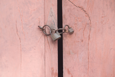 Old padlock on the wooden door, vintage styleの写真素材
