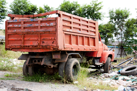 Old rusty abandoned red truckの写真素材