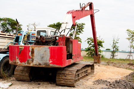 An abstract view of an old truck near working construction siteの写真素材