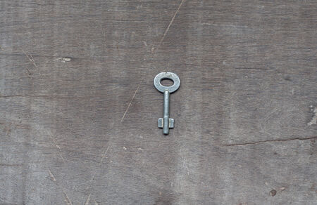 A key on wooden tableの写真素材