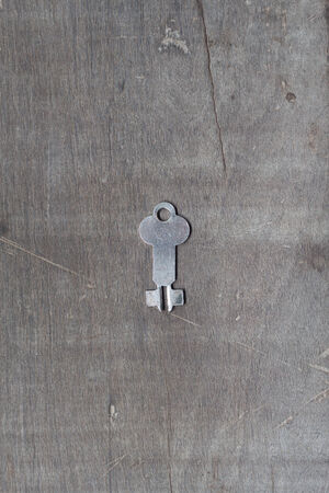A key on wooden tableの写真素材