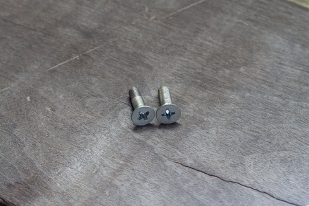 Screws on woodの写真素材