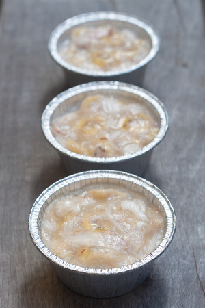 Streamed palm cake, banana dessert in foil cup, Thai traditional cuisineの写真素材