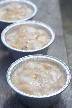 Streamed palm cake, banana dessert in foil cup, Thai traditional cuisineの写真素材
