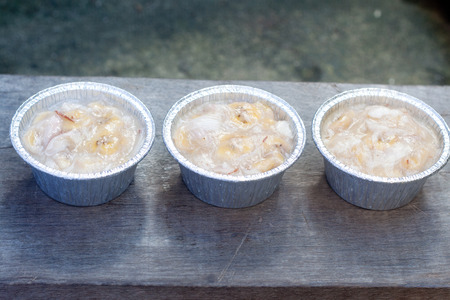 Streamed palm cake, banana dessert in foil cup, Thai traditional cuisineの写真素材