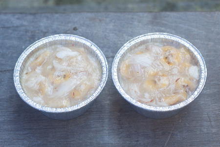 Streamed palm cake, banana dessert in foil cup, Thai traditional cuisineの写真素材