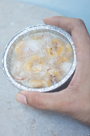 Streamed palm cake, banana dessert in foil cup, Thai traditional cuisineの写真素材