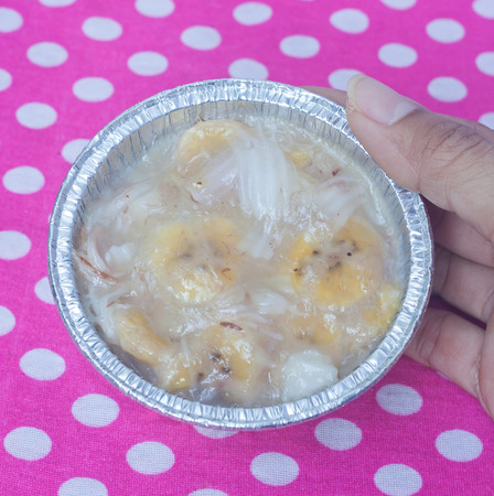 Streamed palm cake, banana dessert in foil cup, Thai traditional cuisineの写真素材