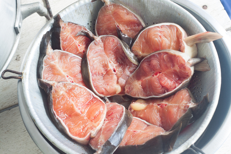 Fresh raw catfish on sieve prepare for food, close upの写真素材