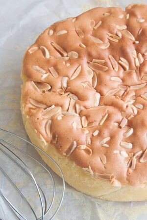 Homemade butter cake with almond stick on topの写真素材