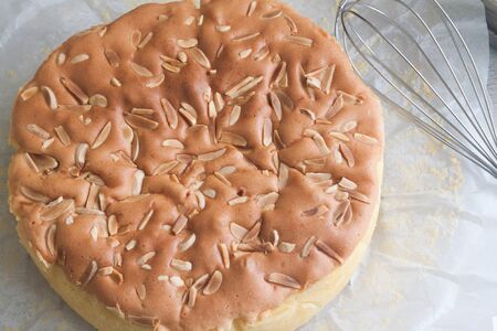 Homemade butter cake with almond stick on topの写真素材