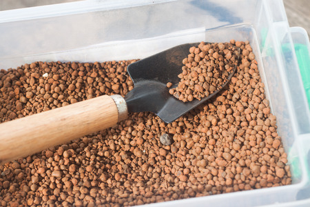pumice pebbles in bucket  and gardening toolの写真素材