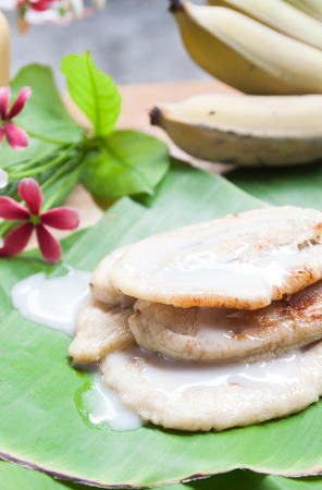 Thai traditional sweet made from banana on banana leafの写真素材