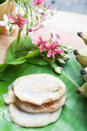 Thai traditional sweet made from banana on banana leafの写真素材