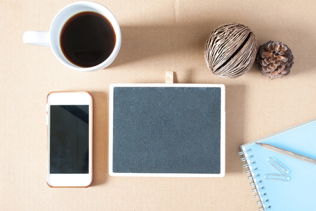 Creative flat lay photo of workspace desk with stationery, coffee and smartphone with copy space background, minimal styledの写真素材