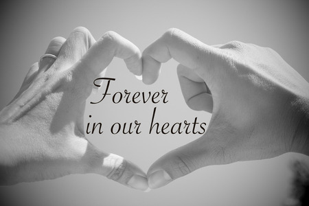 Forever in our hearts quote with beautiful love shape hands, heart shape with black and white