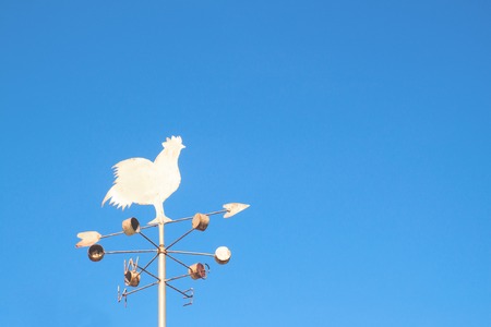 Chicken windmill with blue skyの写真素材