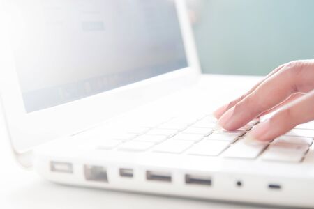 Hand on keyboard of laptop, Online shopping concept with copy spaceの写真素材