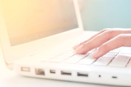 Hand on keyboard of laptop, Online shopping concept with copy spaceの写真素材