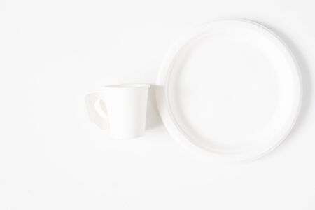 Take-out coffee cup and dish isolated on white backgroundの写真素材