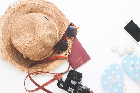 Flat lay of summer items and passport, Travel concept on white background with copy spaceの写真素材