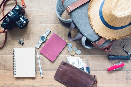 Overhead view of man's accessories, Traveler items on wooden background. Travel conceptの写真素材