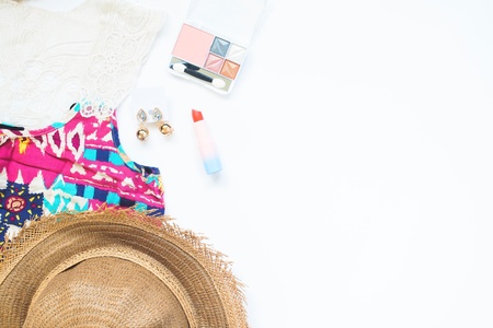 Overhead view of woman essentials and cosmetics on white background, Beach and beauty fashion conceptの写真素材