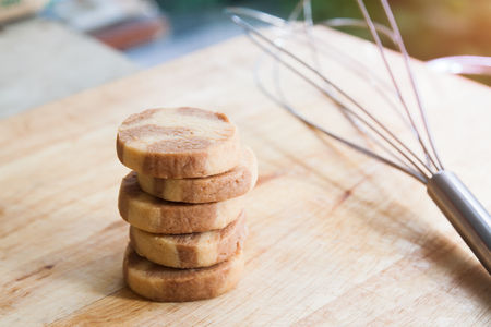 Stack of homemade cookies on wooden tableの写真素材