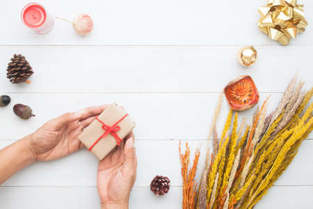 Woman hands holding gift box, Christmas and New Year conceptの写真素材
