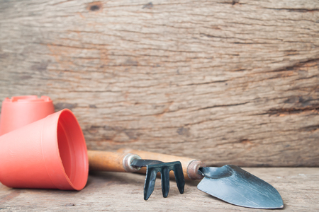 Gardener's desk, garden tools and pottery on wooden, Hobby and lifestyle conceptの写真素材