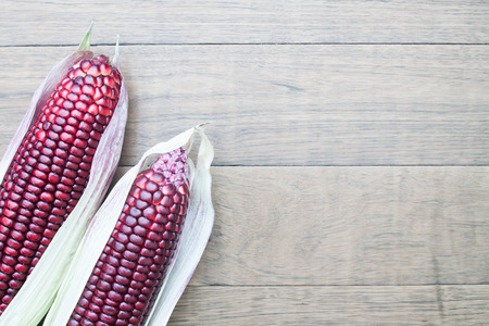 Siam Ruby Queen sweet corn on wooden backgroundの写真素材