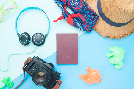 Creative flat lay passport, camera, headphone and woman's accessories for summer, Summer travel conceptの写真素材