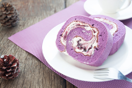 Close up sponge roll cakes with blueberry creamの写真素材