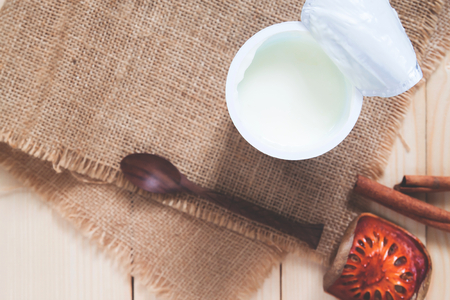 Flat lay cup of yoghurt on table with copyspace, Healthy and dairy productの写真素材