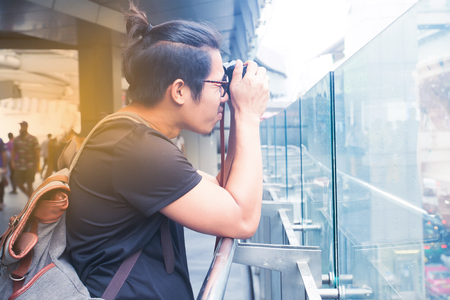Asian handsome guy taking picture of Bangkok cityscape, Lifestyle, Travel conceptの写真素材