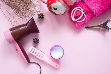 Hair products and treatment with girl accessories on pink background, Flat lay beauty conceptの写真素材