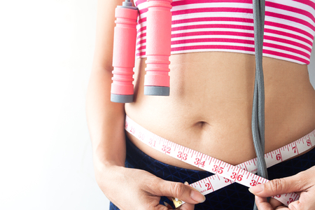 Woman measuring her body, Healthy and Diet lifestyleの写真素材