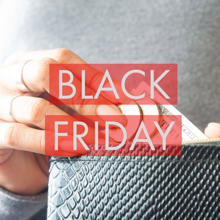 Black Friday Sale lettering with woman hands holding money, banner, brochureの写真素材